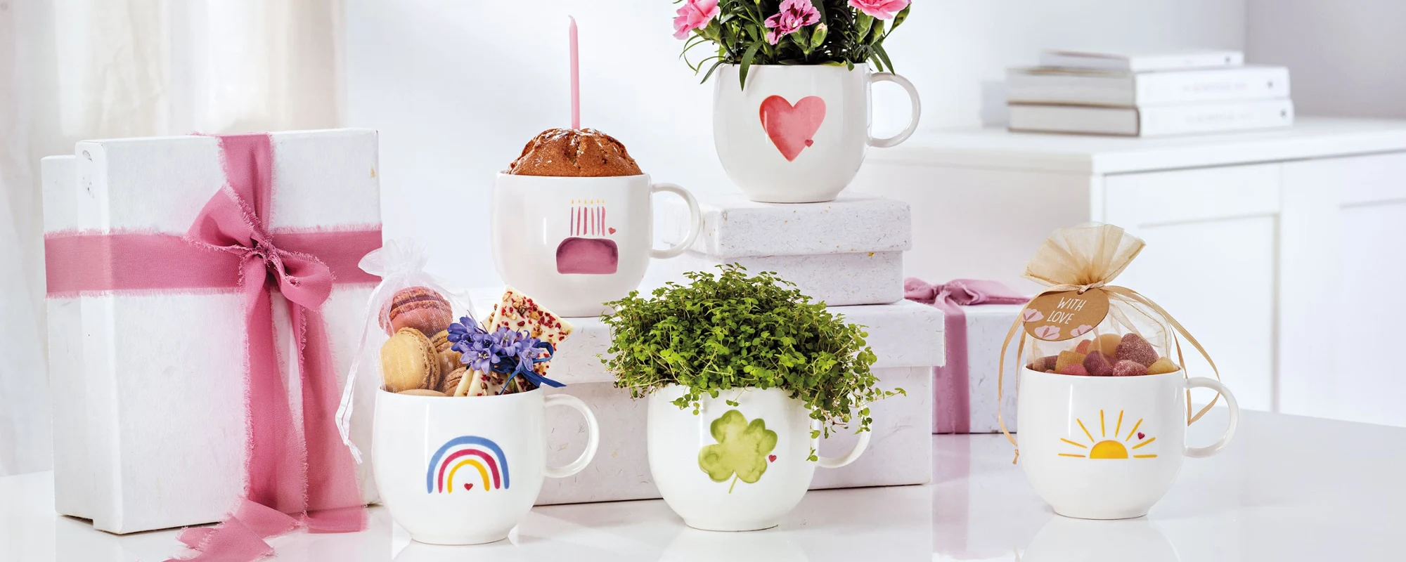 with-love-5-mugs-with-diffrent-designs-on-a-white-table